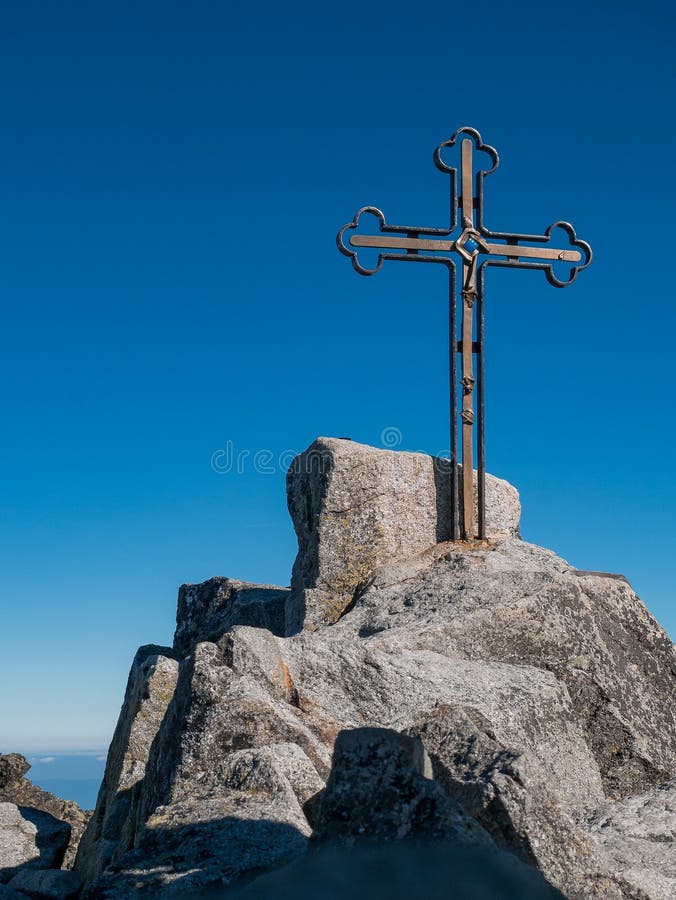 The peak of the highest mountain in Slovakia, Gerlachovsky Stit, on which a cross rises