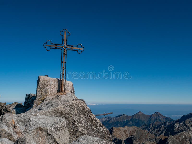 The peak of the highest mountain in Slovakia, Gerlachovsky Stit, on which a cross rises