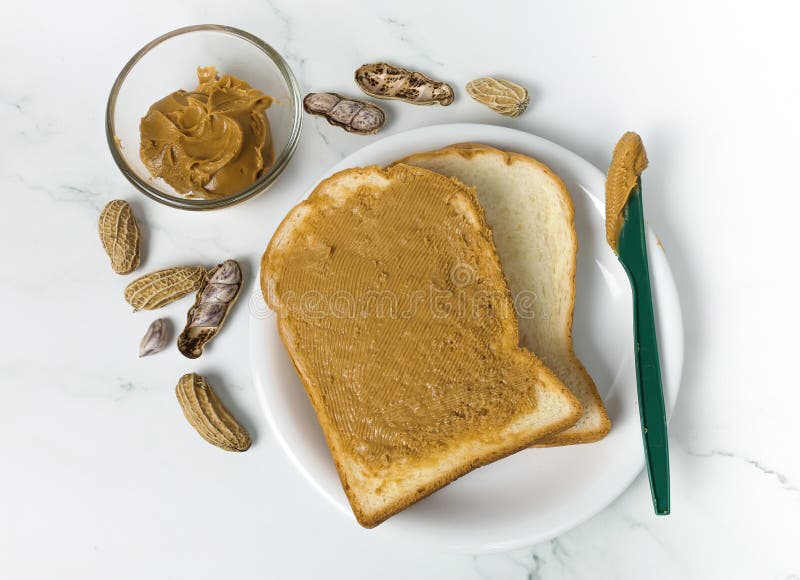 Peanut butter spread on a knife Stock Photo by ©magone 70606539