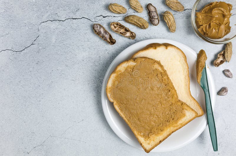 Peanut butter spread on a knife Stock Photo by ©magone 70606559