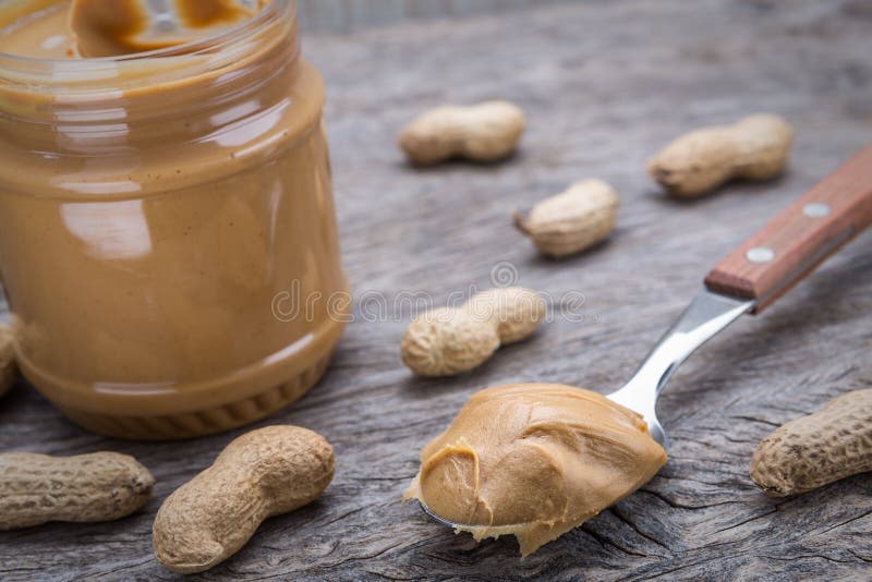 Peanut cream in spoon. Dietary foods for the heart.