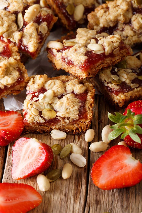 Peanut and Strawberry Jelly Oat Bar Squares close-up. Vertical