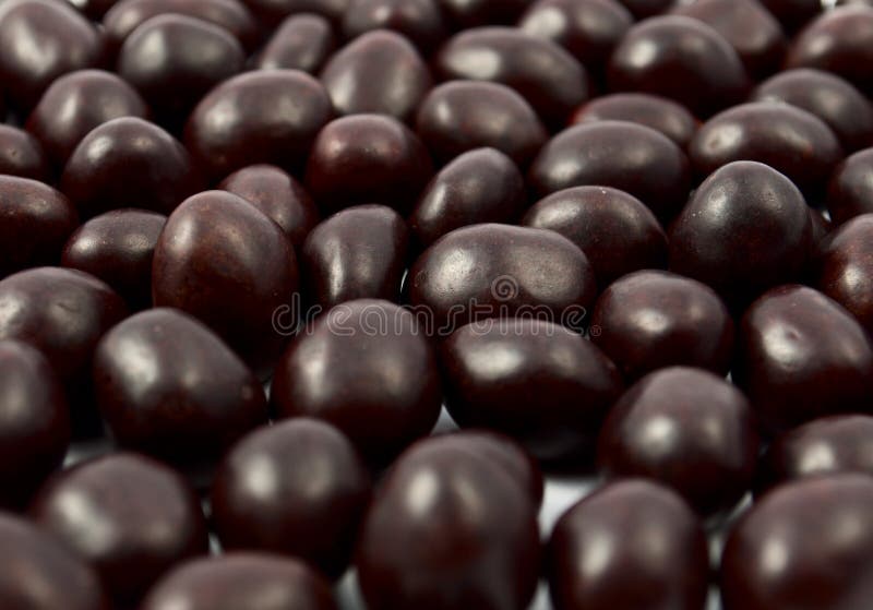 Peanuts or almonds covered with chocolate