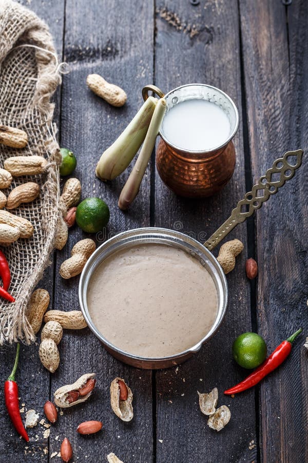 Peanuts, chili, limes, lemongrass and coconut milk for peanut sauce. stock image Peanuts, chili, limes, lemongrass and coconut milk for peanut sauce. stock image
