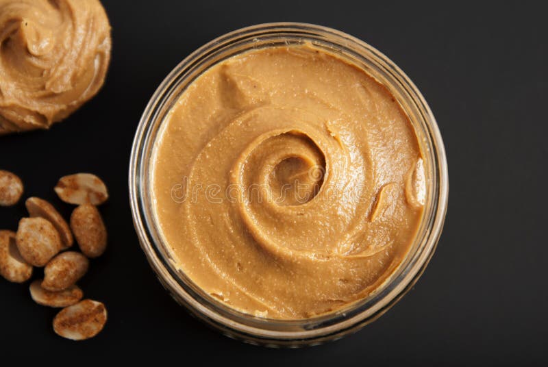 Peanuts and Fresh Peanut Butter Isoalted Black Background Protein Super Food Snack
