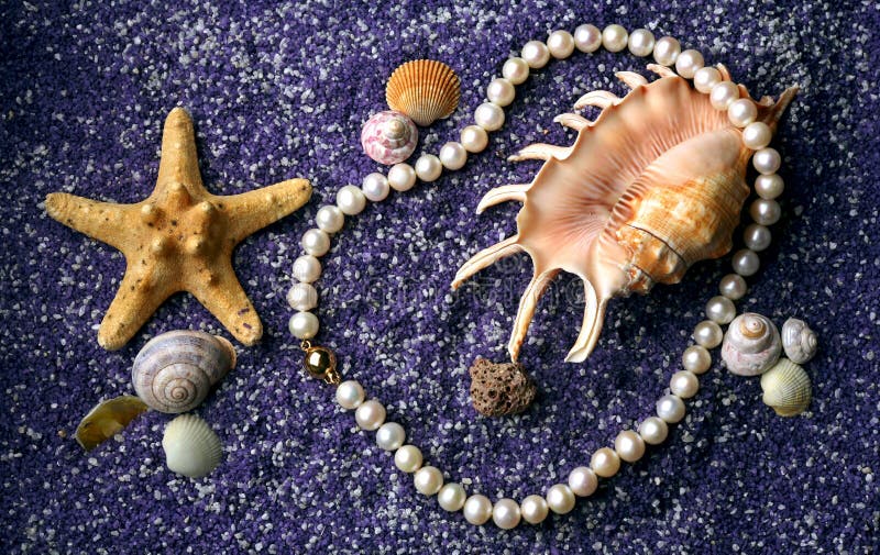 Pearl necklace with seashell and starfishes