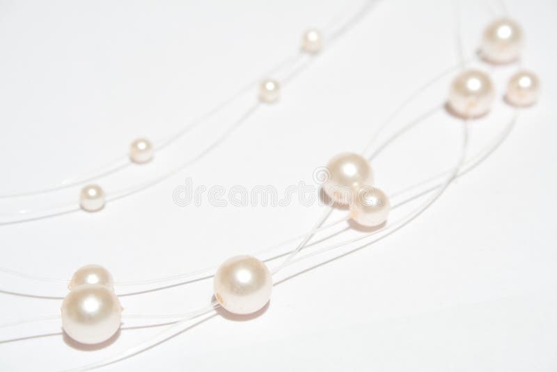Pearl necklace on white isolated background