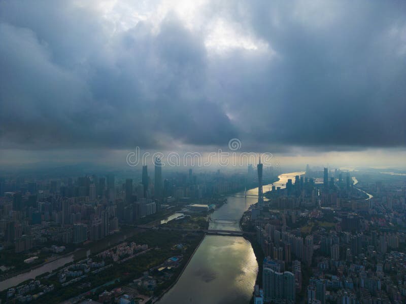 The Pearl River flowing through Guangzhou in the cloudy morning. The Pearl River is a composite water system formed by the convergence of Xijiang River, Beijiang River, Dongjiang River and the the Pearl River Delta. It generally originates from the upper source of the Xijiang River, originates from Mount Majong of the Wumeng Mountains in the the Yunnan-Guizhou Plateau, flows through six provinces (regions) of Yunnan, Guizhou, Guangxi, Guangdong, Hunan and Jiangxi, and flows through the north of Vietnam.