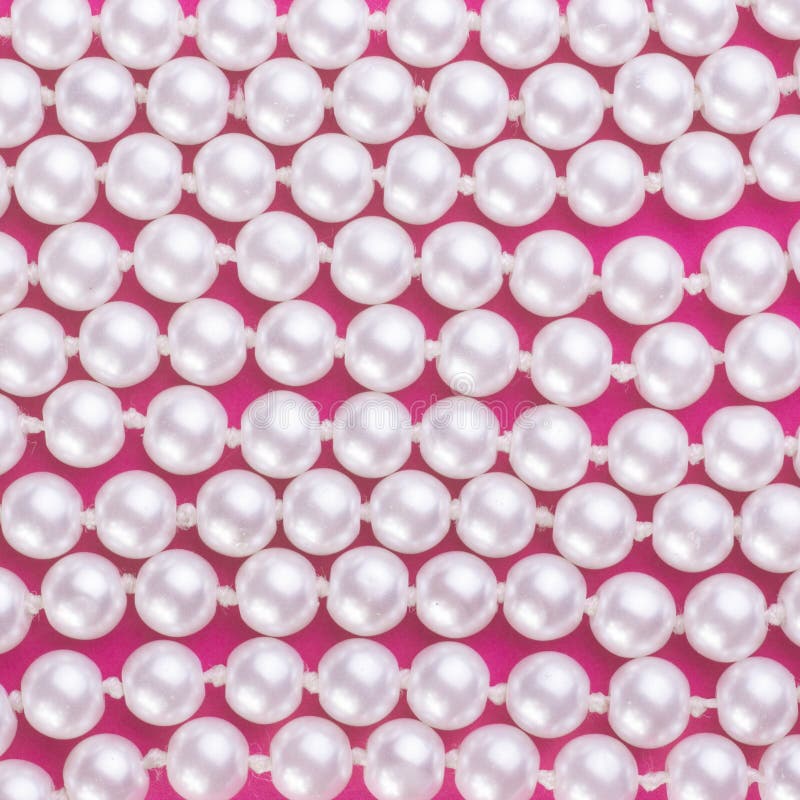Pearls on pink background stock image. Image of folds 76044963