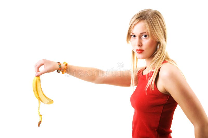 A really mean woman droping a banana skin with intent. A really mean woman droping a banana skin with intent