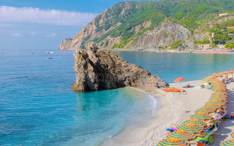 Pebble Beach Monterosso Vacation Chairs and Umbrellas on the Beach of ...