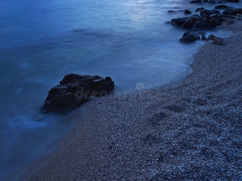 Pebbles beach at misty sea royalty free stock images Pebbles beach at misty sea royalty free stock images