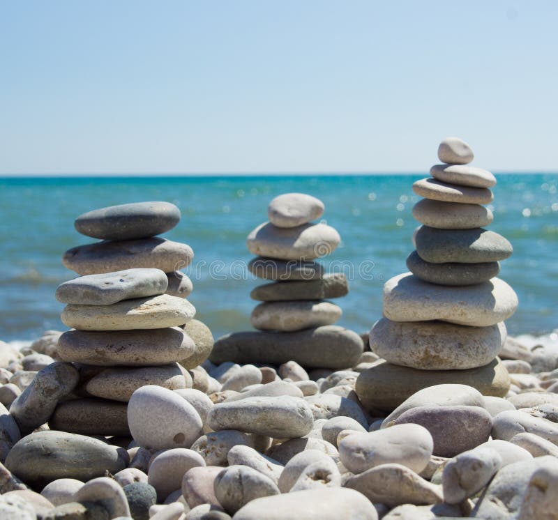 Pyramid of pebbles on a sea beach. royalty free stock images