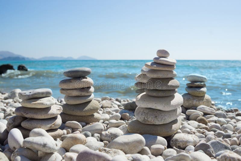 Pyramid of pebbles on a sea beach. stock images