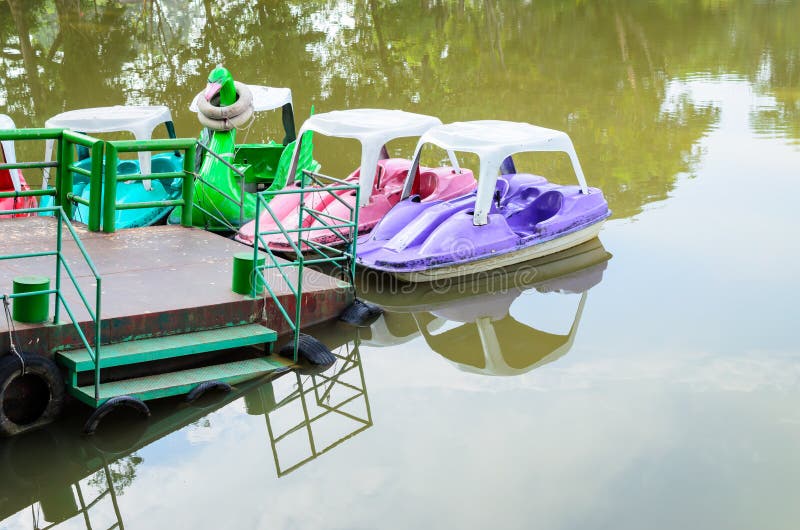Pedal boats on a lake stock photo. Image of boat, thai 54941204