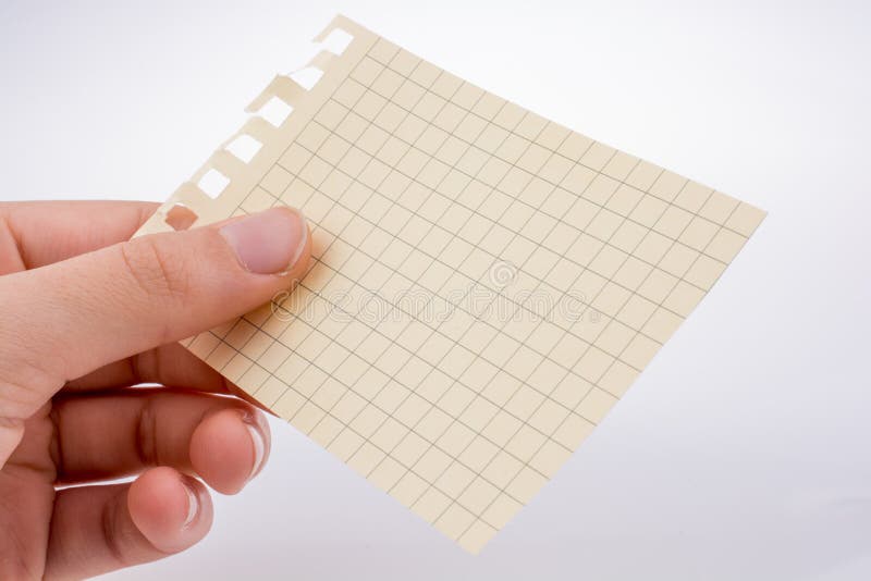 Um pedaço de papel na mão fotos de stock