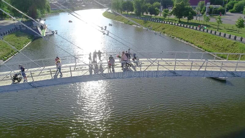Pedestrian bridge over the river, white beautiful pedestrian bridge across the river stock footage