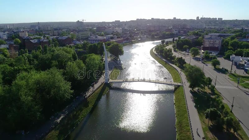 Pedestrian bridge over the river, white beautiful pedestrian bridge across the river stock footage