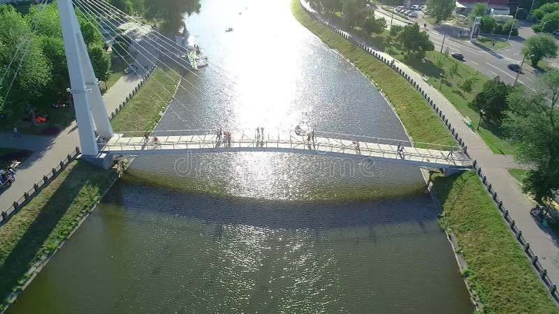 Pedestrian bridge over the river, white beautiful pedestrian bridge across the river stock video