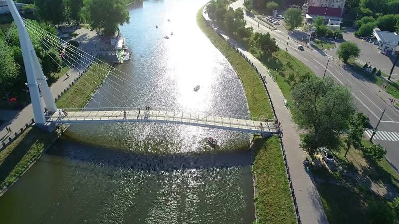 Pedestrian bridge over the river, white beautiful pedestrian bridge across the river stock video footage