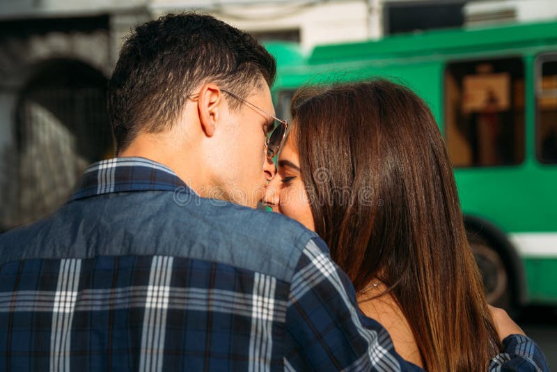 At the Pedestrian Crossing a Guy Kisses a Girl in the Nose and Hugs ...