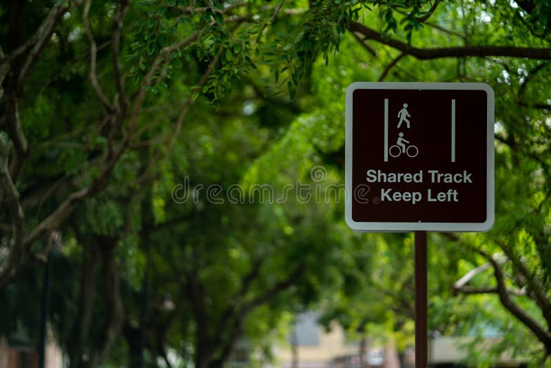 pedestrian-cyclist-shared-track-sign-background-tree-branches-pedestrian-cyclist-shared-track-sign-262353813.jpg
