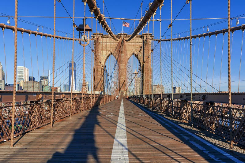 The pedestrian walkway along The Brooklyn Bridge in New York City. Approximately 4,000 pedestrians and 3,100 cyclists cross this historic bridge each day
