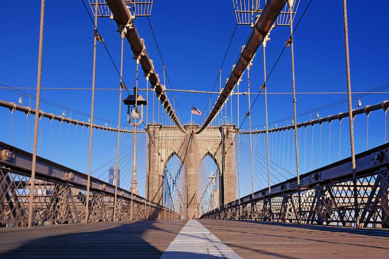 The pedestrian walkway along The Brooklyn Bridge in New York City. Approximately 4,000 pedestrians and 3,100 cyclists cross this historic bridge each day