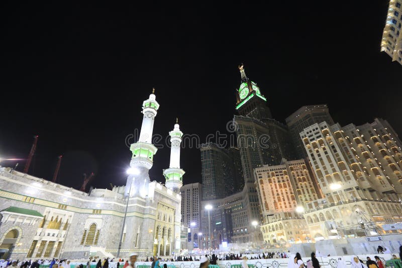 Pedestrians heading to the Haram Mosque in Mecca and Mecca Royal Clock Tower Hotel