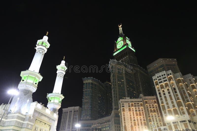 Pedestrians heading to the Haram Mosque in Mecca and Mecca Royal Clock Tower Hotel