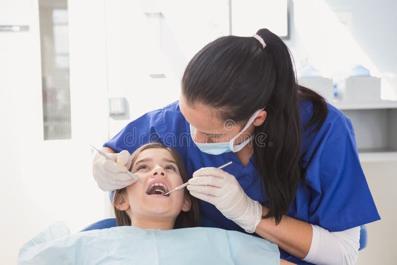 Pediatric Dentist Using Dental Explorer and Angled Mirror Stock Image Image of female, girl