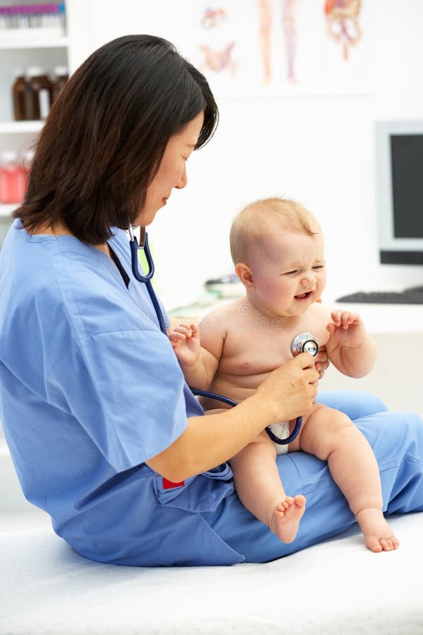 Pediatrician with baby stock image. Image of looking 19903641