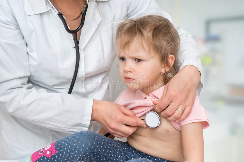 Pediatrician doctor examining a little girl by stethoscope stock photos Pediatrician doctor examining a little girl by stethoscope stock photos