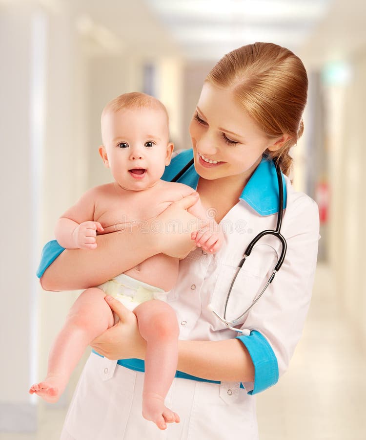 Pediatrician woman doctor holding baby