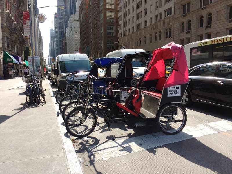 Pedicabs Parked on 6th Avenue Near Central Park, New York City, NYC, NY, USA stock photography Pedicabs Parked on 6th Avenue Near Central Park, New York City, NYC, NY, USA stock photography