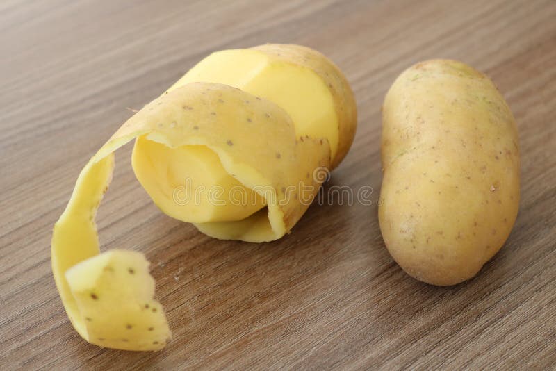 Peel Potato. Potato and Peel. Peeled Potato. Peeling Potato Stock Image