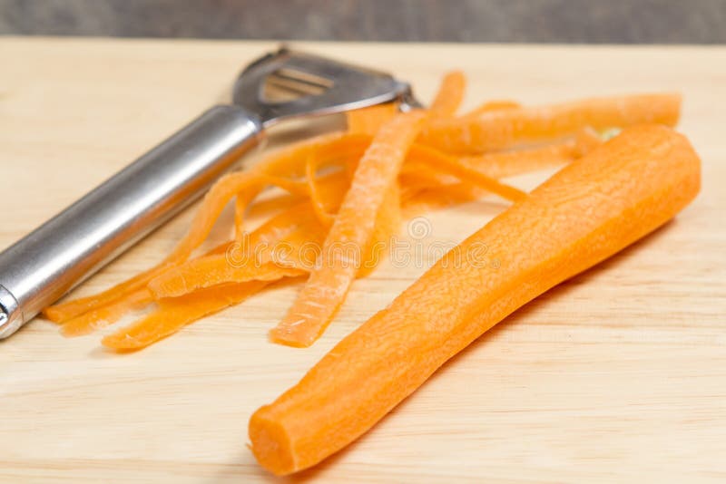 Peeled Carrots with a Tool for Peeling Stock Image Image of closeup