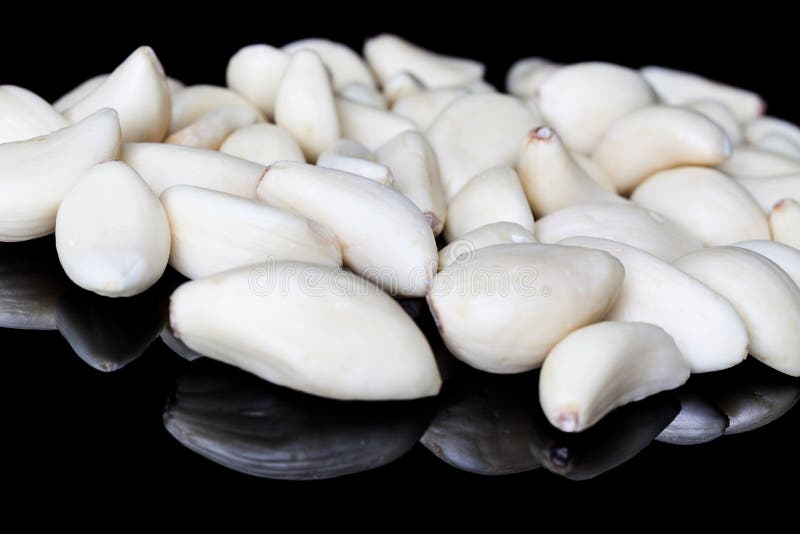 Peeled garlic cloves stock image. Image of natural, black 59101695