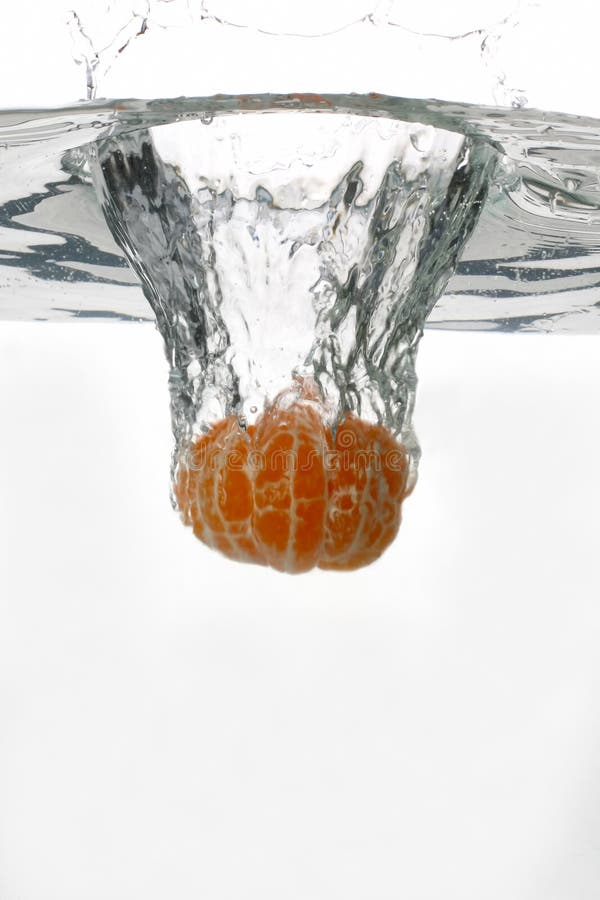 Orange Falls into the Water Stock Photo Image of closeup, concentric