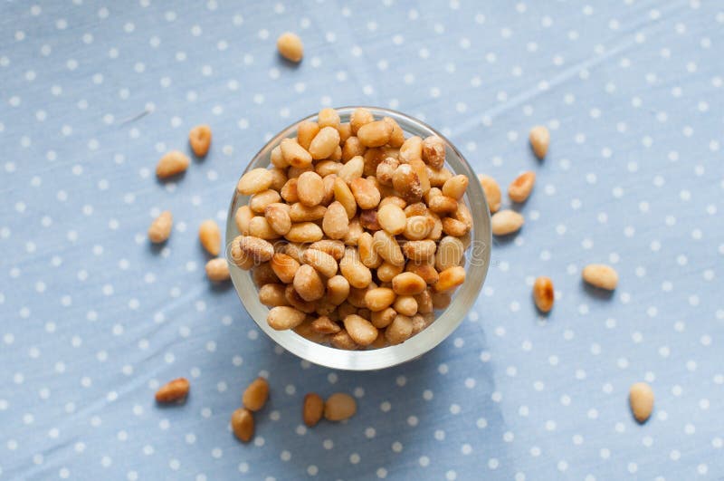 Peeled pine nuts stock photography