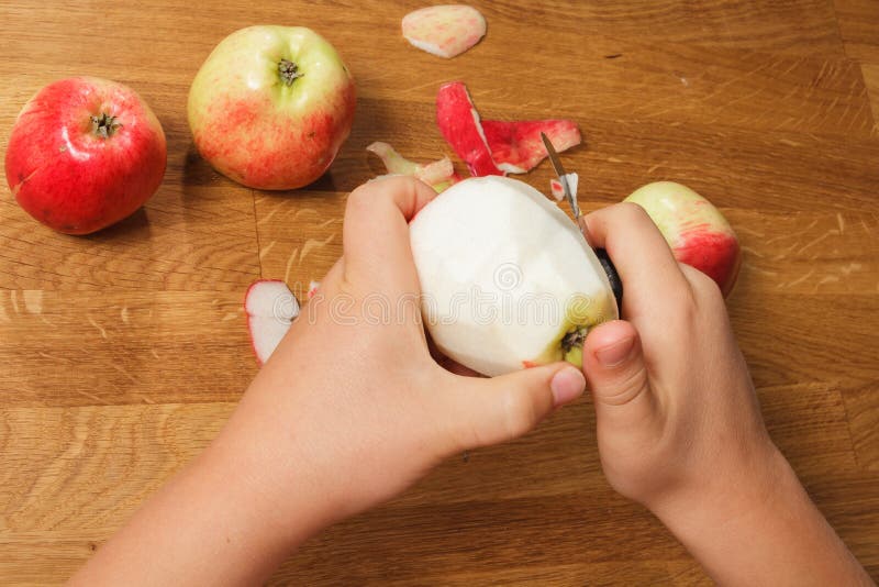 Peel the apple stock photo. Image of food, knife, cooking 43961800