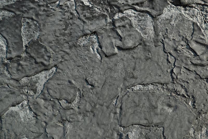 Peeling Black Paint on a Concrete Wall. Abstract Background Stock Image