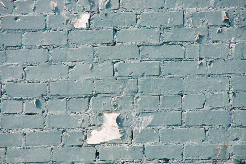 Peeling Blue Paint on Old Brick Wall