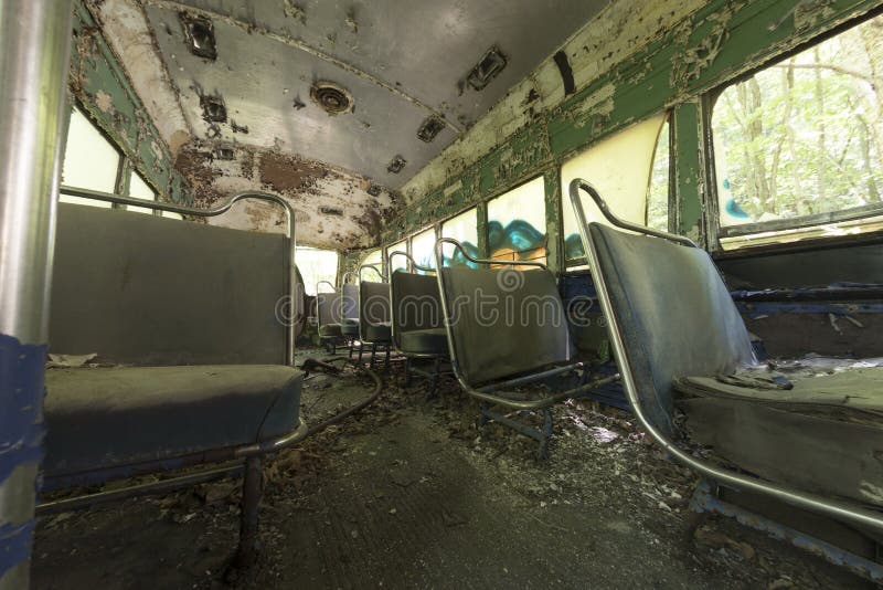 Peeling seats inside abandoned trolley car royalty free stock photos