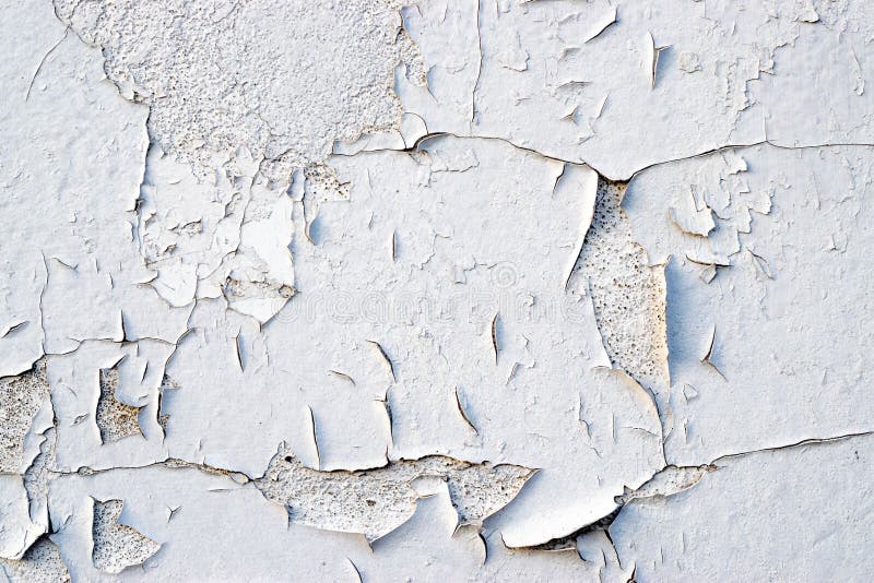 Peeling wall paint. Old flakes wallpaper, worn texture backgroun