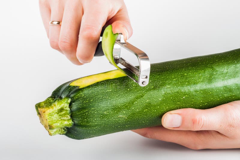 Peeling Zucchini with Peeler Stock Photo Image of cook, agriculture