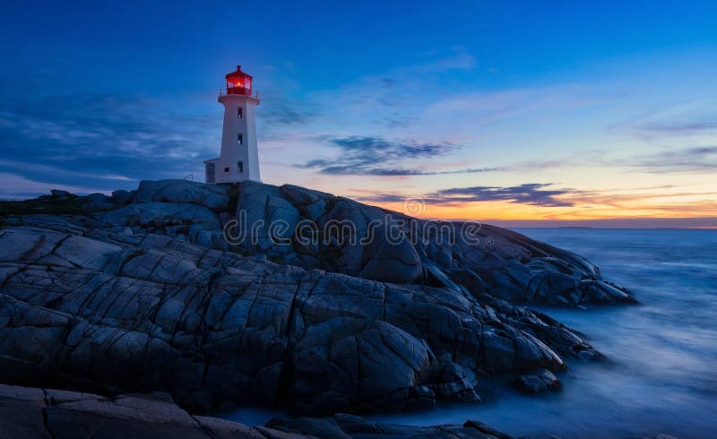 Peggy`s Cove Lighthouse. Nova Scotia Canada in the sunset, colorful, scenic