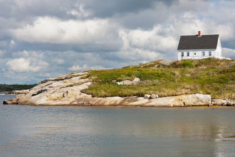 Picturesque house on the rocks in Peggys Cove, Nova Scotia. Picturesque house on the rocks in Peggys Cove, Nova Scotia