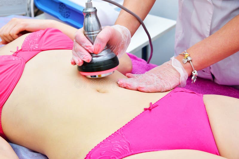 Pele que aperta, barriga do Rf Cosmetologia do hardware Cuidado do corpo Esculpir não cirúrgico do corpo Tre de contorno do corpo imagem de stock royalty free Pele que aperta, barriga do Rf Cosmetologia do hardware Cuidado do corpo Esculpir não cirúrgico do corpo Tre de contorno do corpo imagem de stock royalty free