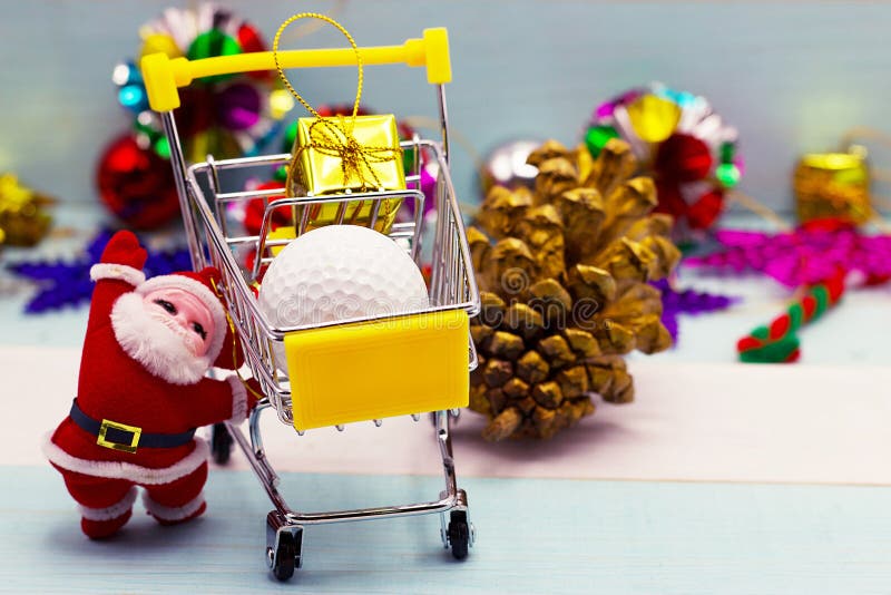 Santa is shopping golf ball for golfer`s gift on Christmas holiday. Santa is shopping golf ball for golfer`s gift on Christmas holiday